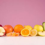 graphicstock-composition-with-fresh-sliced-peeed-fruits-apple-grapefruit-orange-lemon-apple-avocado-on-a-table-isolated-on-a-pink-background_r8vlJYuXunx_thumb
